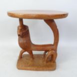 An Ashanti Tribal hardwood table, with lion carved base, 51cm x 58cm x 51cm