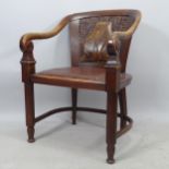 A Victorian studded upholstered and carved oak desk chair, on fluted legs