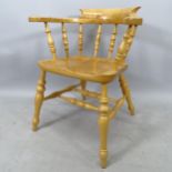 An elm-seated bow-arm Captain's chair