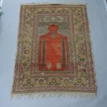 A Middle Eastern red ground prayer rug, 170cm x 125cm