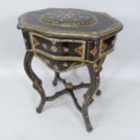 A Victorian gilded and lacquered sewing table, with inlaid mother-of-pearl decoration on shaped