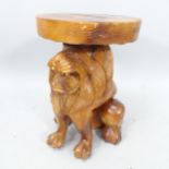 A decorative stained hardwood stool/jardiniere stand, on a carved lion stand, H46cm