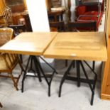 A pair of modern rise and fall pub tables with metal base, top dimensions 61cm x 56cm