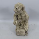 A composite garden statue in the form of a gargoyle, H58cm