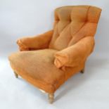 A Howard style button-back upholstered armchair