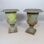 A pair of weathered cast-iron Campana urns, 50cm x 70cm