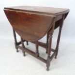 An oak oval gateleg table