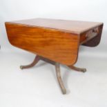 A 19th century mahogany drop leaf table, with end frieze drawer, on sabre legs, 104cm x 71cm x 60cm