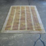 A modern beige and lemon ground carpet, 308cm x 250cm (Viewing by appointment only for this Lot as