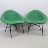 A pair of mid-century Italian saucer-shaped lounge chair, upholstered fibreglass shell on black