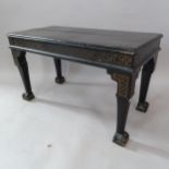 An ebonised stool with gilt decoration, on claw and ball feet, 62cm x 37cm x 31cm