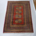 A red and blue ground Turkish rug, 190cm x 135cm