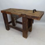 A Vintage stained pine work bench with fitted vice, 130cm x 78cm x 46cm