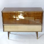 A mid-century mahogany and teak-cased radiogram, with Garrard turntable, 103cm x 82cm x 39cm