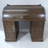 A 19th century oak cylinder-front twin-pedestal writing desk, with fitted and sliding interior,