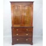 An Antique mahogany 2-section linen press, the top section having a hanging rail and bottom with 3