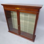 An Edwardian mahogany table-top display cabinet, with adjustable glass shelves and 2 bevelled glazed
