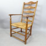 A Cotswold School design rush-seated ladder-back armchair