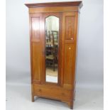 An Edwardian mahogany single mirror-door wardrobe, with drawer-fitted base, 97cm x 196cm x 44cm