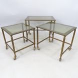 A rectangular brass-framed nest of 3 glass-top occasional tables, W53cm