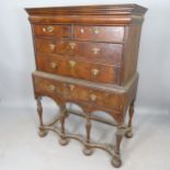 An 18th century mahogany 2-section chest on stand, top section having 2 short and 2 long drawers,