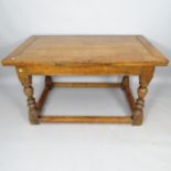 A 19th century oak draw leaf dining table, on turned legs, with all round stretcher, 136cm (