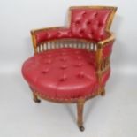 An Antique mahogany circular seated desk chair, with button-backed rexine upholstery