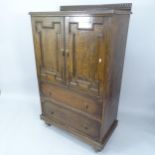 A 1930s oak compactum with slide fitted top and 2 drawers under, 89cm x 150cm x 49cm