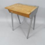 A mid-century teak and metal-framed school desk, by Esavian, with lifting top and converse legs,