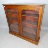 A Victorian mahogany bookcase, with 2 glazed panelled doors and 3 adjustable shelves, 117cm x