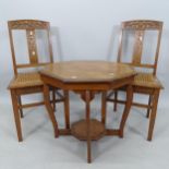 A pair of Arts and Crafts oak side chairs, with stylised inset decoration and cane-panelled seats,
