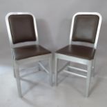 A pair of industrial style brushed-aluminium side chairs, in the manner of Emeco