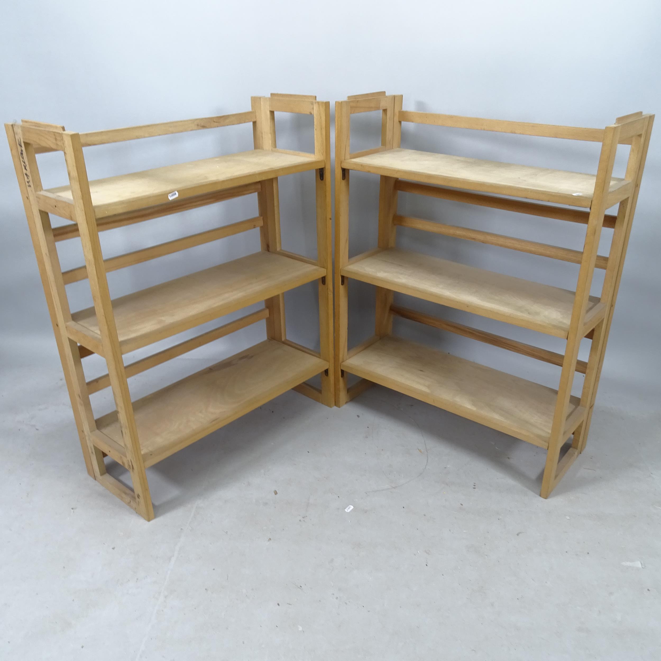 A pair of beech folding display stands, 71cm x 95cm x 29cm