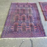 A red ground Afghan carpet, 295cm x 210cm (Viewing by appointment only for this Lot as it is not