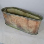 An Antique copper bath, 162cm x 63cm x 68cm