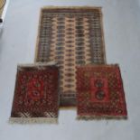 2 small Afghan mats, and a salmon ground Afghan rug (3)