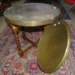 An Anglo-Indian engraved brass-top table, on barley twist folding base, 60cm x 59cm, and another