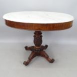 A 19th century Gueridon table, with oval white marble top, raised on an acanthus leaf centre