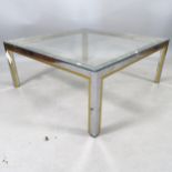 A contemporary design chrome and brass-framed square glass-top coffee table, 90cm x 38cm