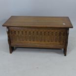 A small oak coffer with Arcadian carved panelled front, 80cm x 40cm x 33cm