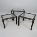 A contemporary nest of 3 occasional tables, with painted metal frames and inset bevelled glass tops,