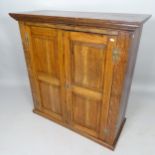 A 19th century oak 2-door hall cupboard, with 2 panelled doors and 3 fitted shelves, 104cm x 108cm x