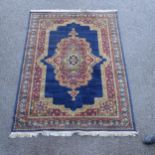 A blue ground Tabriz design rug, 235cm x 170cm