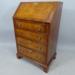 A burr-yew and walnut crossbanded bureau, with 4 graduated drawers on bracket feet, 61cm x 99cm x