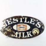 A Vintage Nestle's Milk oval enamel advertising sign, 28cm x 54cm