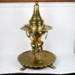 A large Middle Eastern pierced and polished brass coal stove/incense burner on tray stand, overall
