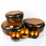 A nesting set of 3 Japanese lacquer boxes and covers, and 5 Japanese lacquer bowls, largest box