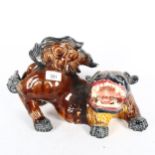 A Chinese ceramic glazed dog of fo (tongue broken), length 35cm