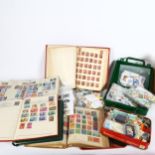 A large quantity of loose world postage stamps and albums