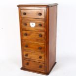 A mahogany table-top chest of drawers, W24cm, H51cm, D22cm